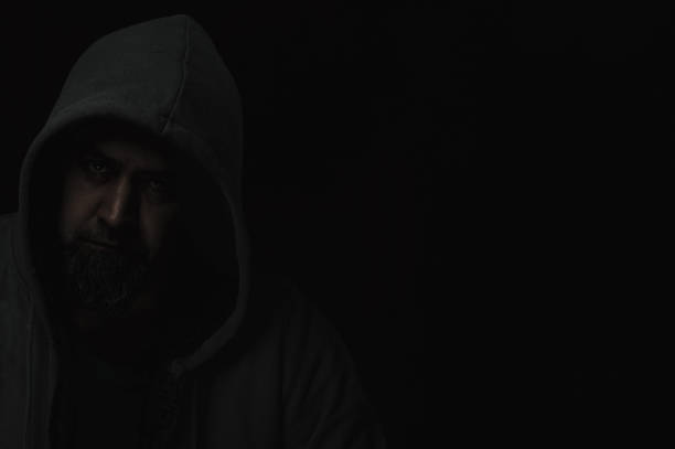 istock Silhouettes of mysterious man with a darkened face and not visible face 2155254960