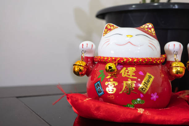 istock Red Maneki-neko on a table in living room 2155260725