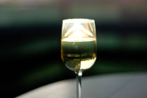 istock White wine in glass whit sunlight 2155260879