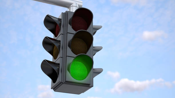 istock Traffic Light With Green Light in Urban Area on Sunny Day Against a Blue Sky 2155262936