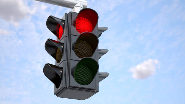 istock Traffic Light With Red Light in Urban Area on Sunny Day Against a Blue Sky 2155263045