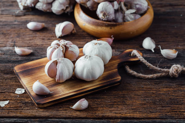 istock garlic on wooden background 2155266306