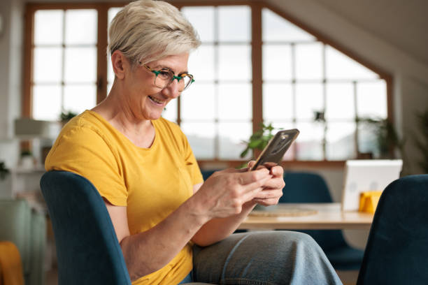 istock Woman talking on her phone at home 2155267052