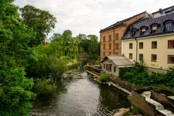 istock View of buildings by a stream 2155267184