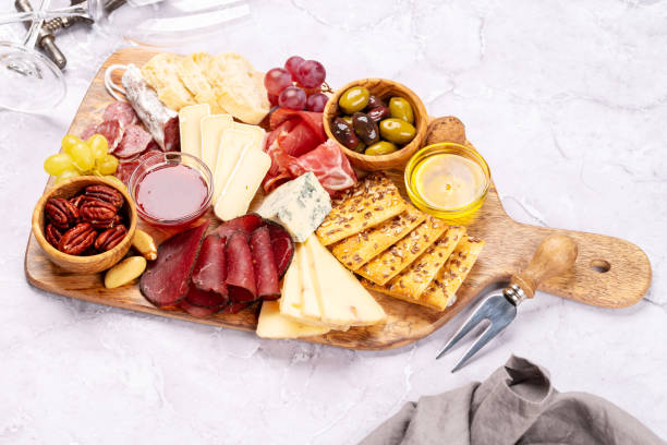 istock Antipasto board with prosciutto, salami, crackers, cheese 2155269697