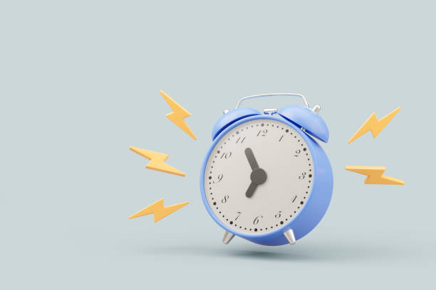 istock A blue alarm clock with yellow lightning bolts around it. on light blue background. 2155269779