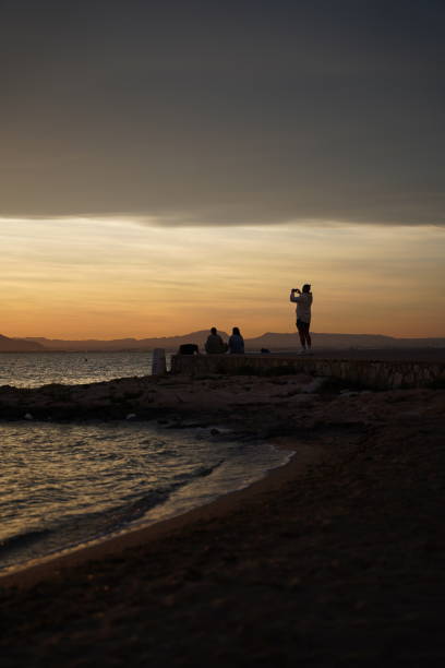 istock Friends watching the sunset in La Manga 2155270474