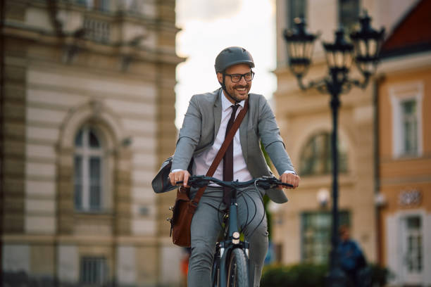 istock Happy entrepreneur riding bicycle on the street. 2155272082
