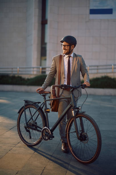 istock Happy entrepreneur commuting to work by bike and looking away. 2155272235