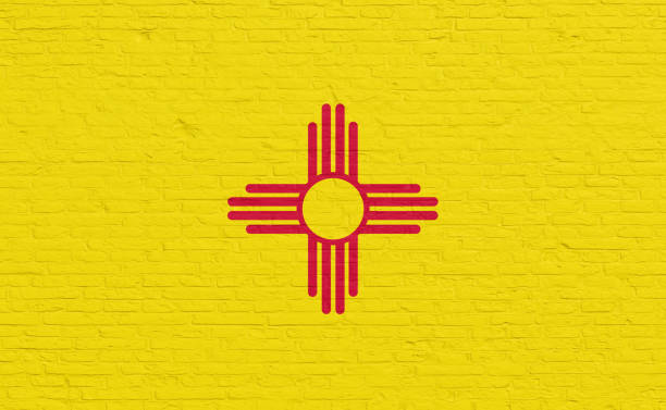 New Mexico flag colors painted on a brick wall. National colors, US state, country, banner, government, New Mexico culture, politics, United States, tourism.