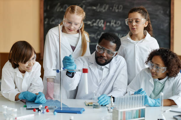 istock Teacher Demonstrating Chemical Reaction 2155273101