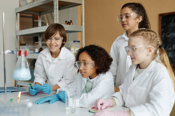 istock Group of Kids Doing Chemical Experiment 2155273158