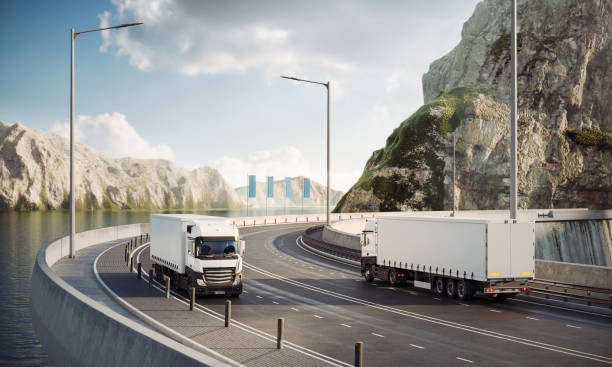 istock Digitally Generated Transport Trucks on Mountainous Coastal Road 2155273316
