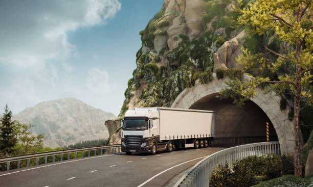 istock Digitally Created Image of a Transport Truck Exiting a Mountain Tunnel 2155273326