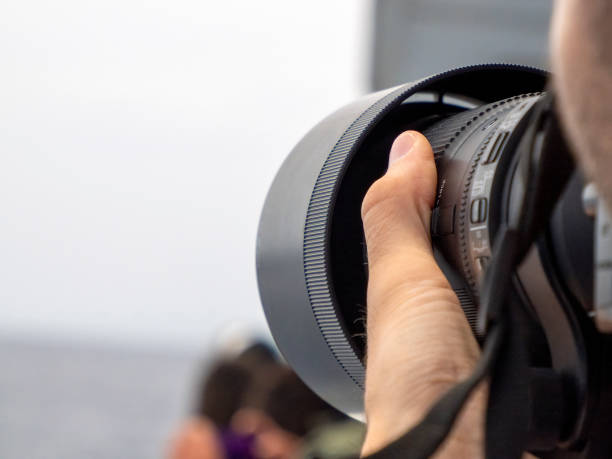 istock Wildlife photographer using tele lens on a whale watching boat 2155274847