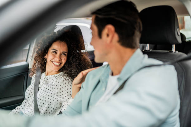 istock Couple talking inside a car on the city 2155275147