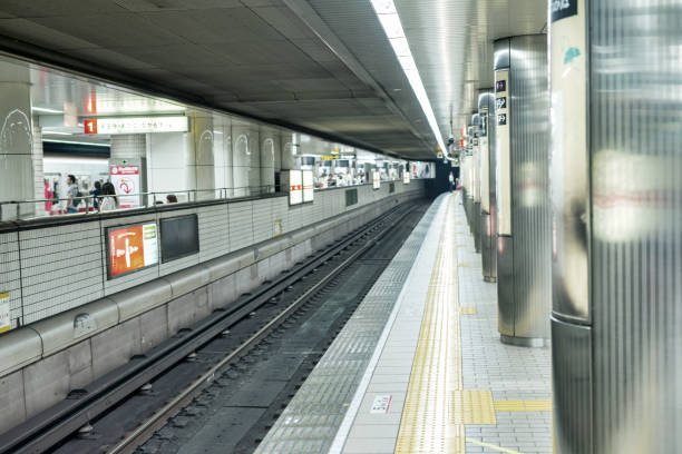 Osaka, Japan - May 28, 2016: Interior of subway station with rail track.
