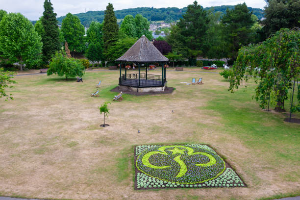 Bath, United Kingdom - July 1, 2010 : Relaxing open space between the town and the River Avon, with the Victorian Bandstand and seasonal decorated flower bed.