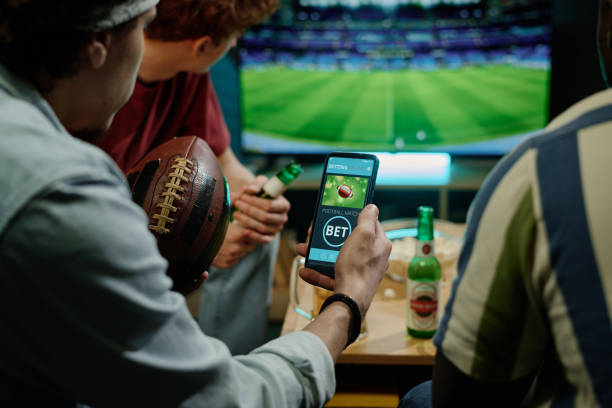 istock Young Men Betting During Football Match 2155275802