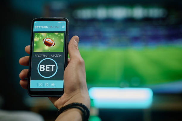istock Unrecognizable Man Betting On Football Team 2155275803