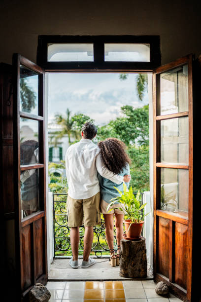 istock Couple talking and admiring the view at hotel 2155275839