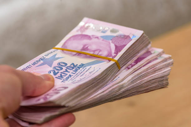 istock paper money held out by a human hand 2155277317