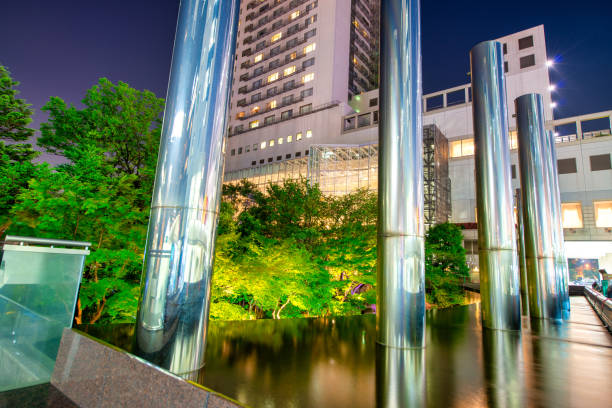 Osaka, Japan - May 28, 2016: Modern city buildings at night.
