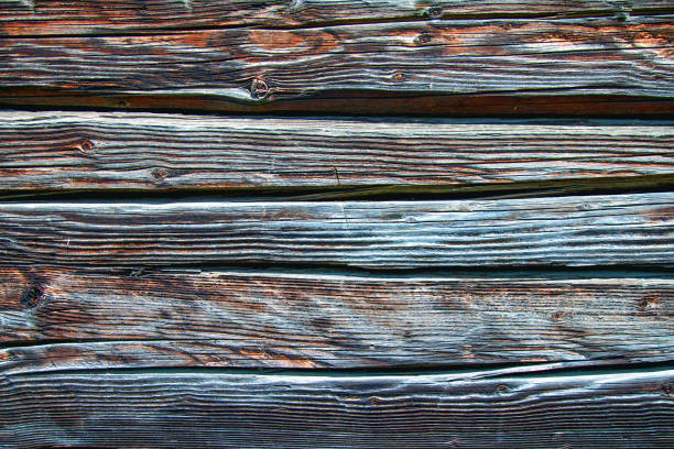 Beautiful grungy cracked wooden board textured background.