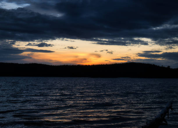 Sunset shot along the beach of a lake while hiking in Acadia National Park.