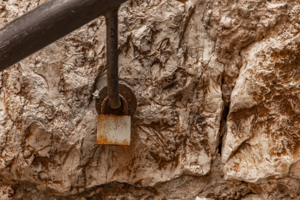 An old rusty padlock hanging on the railing by the stairs Croatia Rovinj