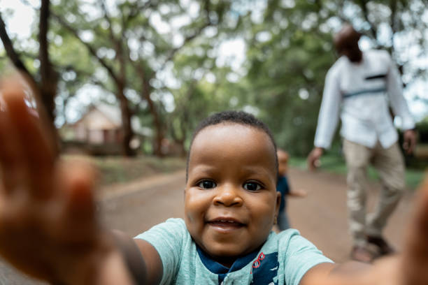 istock Cute african boy running to the camera 2155296282