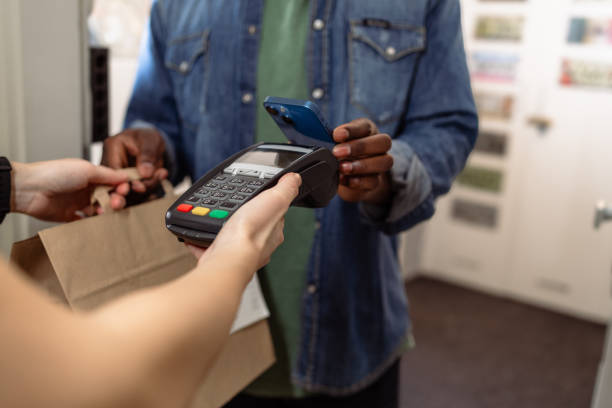 istock Contactless payment using smartphone at a delivery service 2155300855