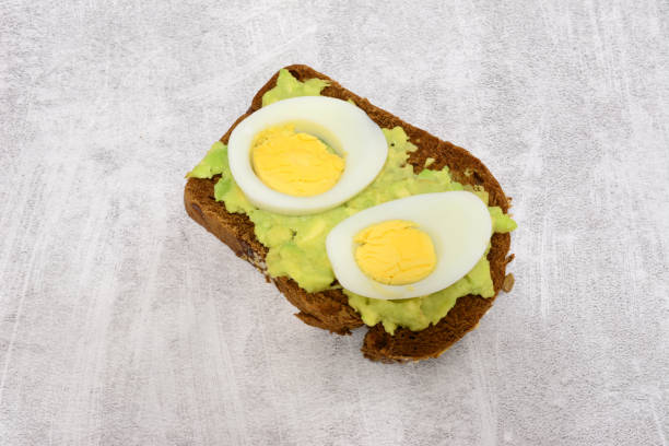 istock hard boiled eggs on a toast with avocado top view 2155302422