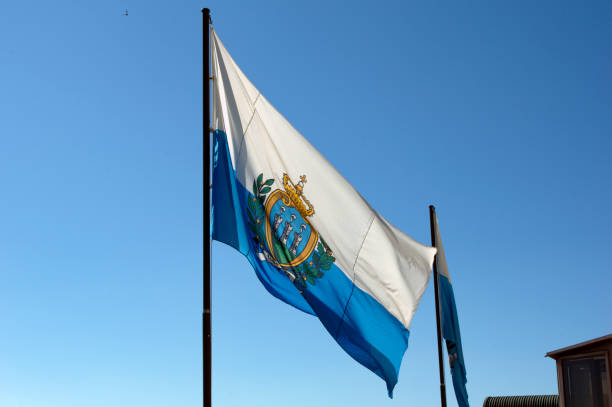 istock flag of San Marino against the sky 2155307698