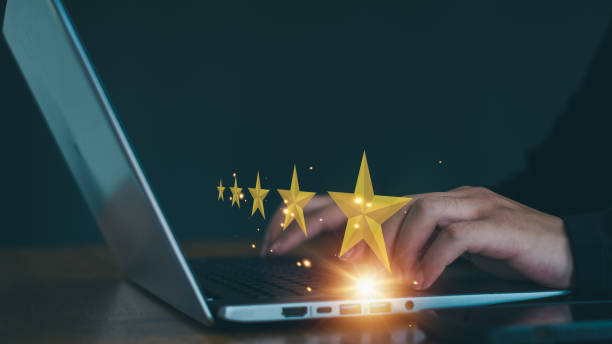 istock Customer service experience and business satisfaction survey, close up  hand using smart phone and give five star symbol to increase rating of product and service concept. 2155307810