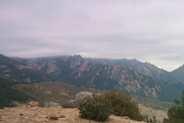 spring view on a cloudy day to the Sierra de Guadarrama mountains near Madrid