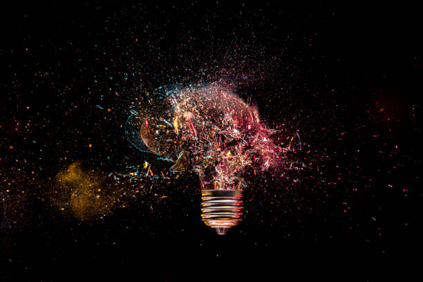 istock Shattered light bulb moment on dark background 2155312401
