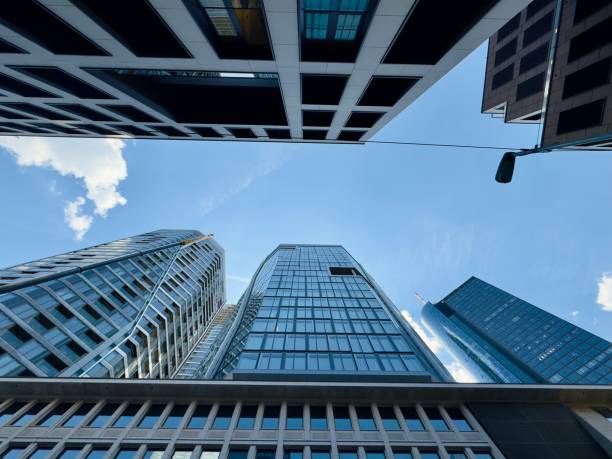 istock looking up at a skyscrapers in the financial district 2155315819