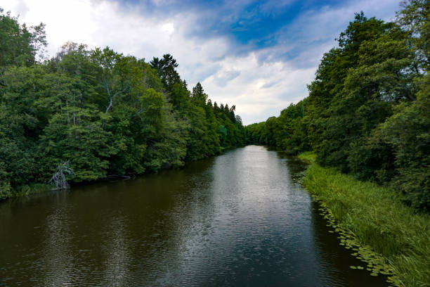 istock Scenic view of a river against cloudy sky 2155316325