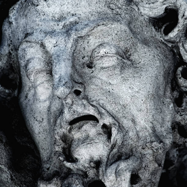 Macro image of ancient statue of Sisyphus with stone. God Zeus punished Sisyphus: he had to roll very big stone to top of high mountain rock, which befor reach the top rolled back down every time. macro imagen de la antigua estatua de sísifo con piedra. el dios zeus castigó a sísifo: tuvo que hacer rodar una piedra muy grande hasta la cima de la roca de la alta montaña, que antes de llegar a la cima volvía a rodar hacia abajo cada vez.