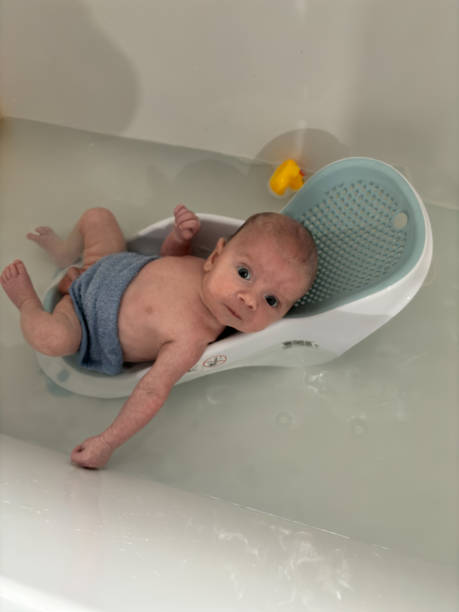 istock A new born baby boy in the bath for the first time 2155317842