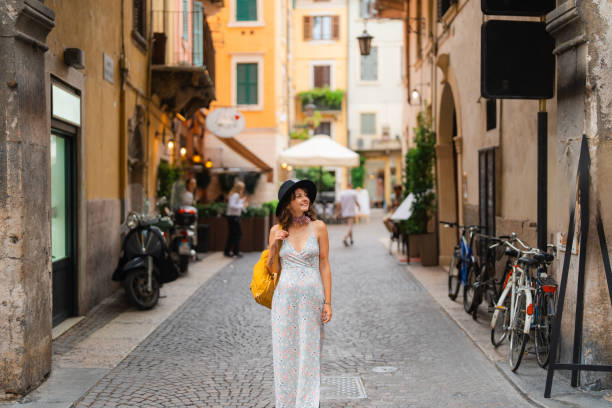 istock Woman exploring Verona during her vacation in Italy 2155317873