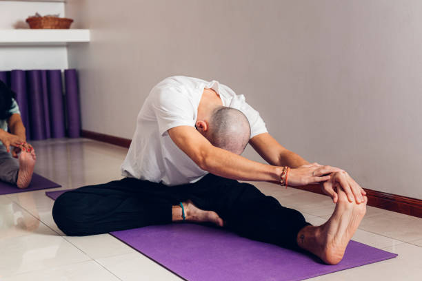 istock Young man in class yoga class. 2155327261