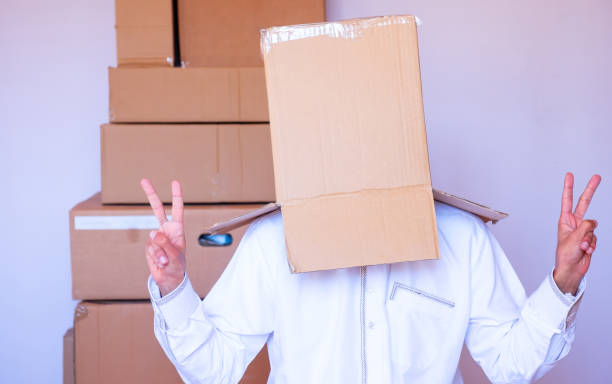 istock arabic man putting carton box on his head 2155327697