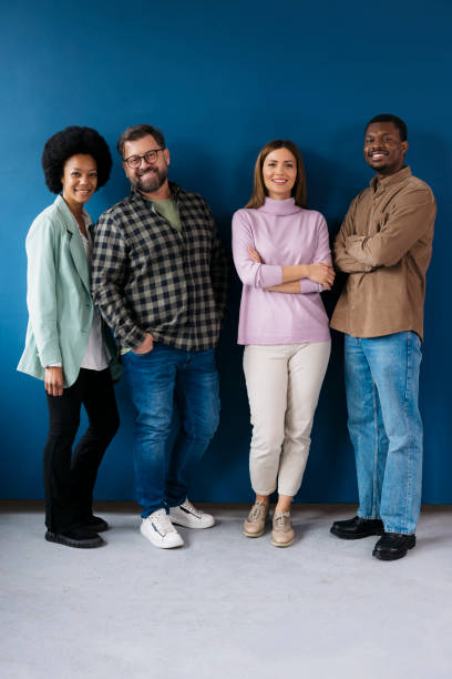istock Diverse business team smiling together against blue background 2155333651