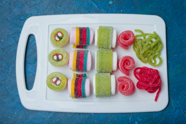 istock Various jelly strips, candies and marshmallows arranged to look like sushi 2155334116
