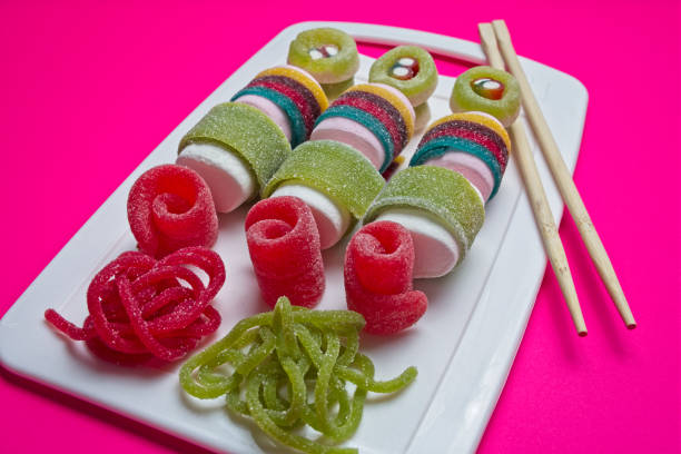 istock Various jelly strips, candies and marshmallows arranged to look like sushi 2155334167