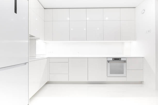istock Front view of a modern luxury trendy snow white kitchen with many cabinets 2155336652