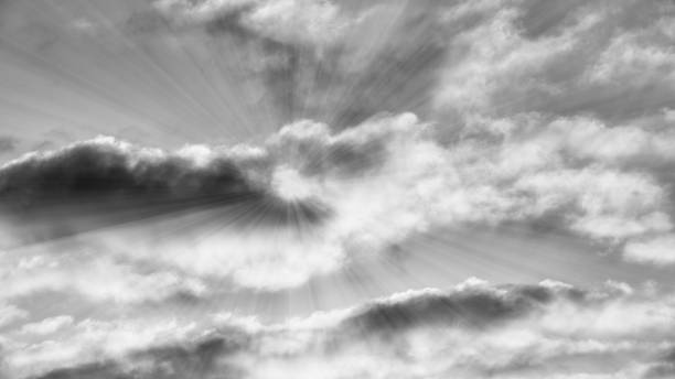 Sun Rays Are Bursting Forth Through Detailed Clouds Black And White