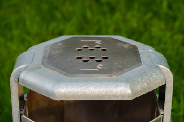 istock A public garbage can with an upper area where you can put out a cigarette and dispose of it. Cigarettes are thrown away in such a way that they cannot burn in the trash can. 2155341412